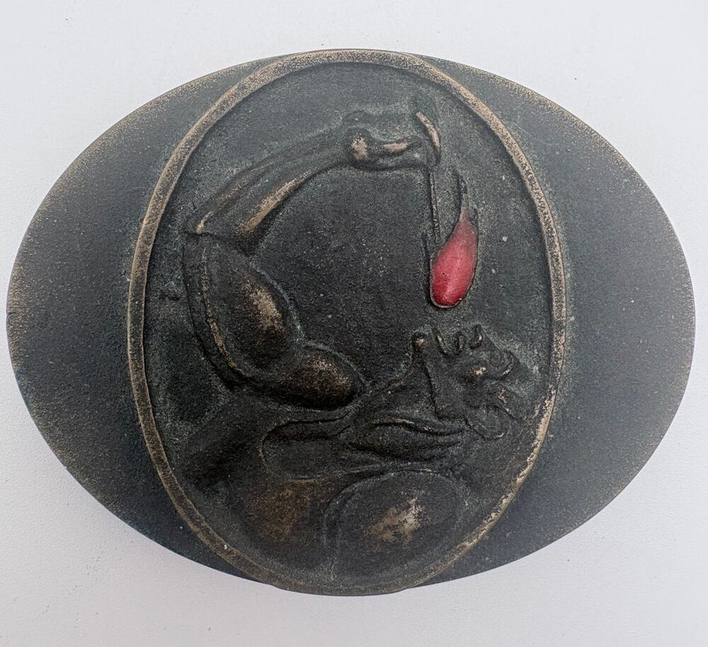 Artisan Bronze Belt Buckle Depicting a Male Figure Eating Firee